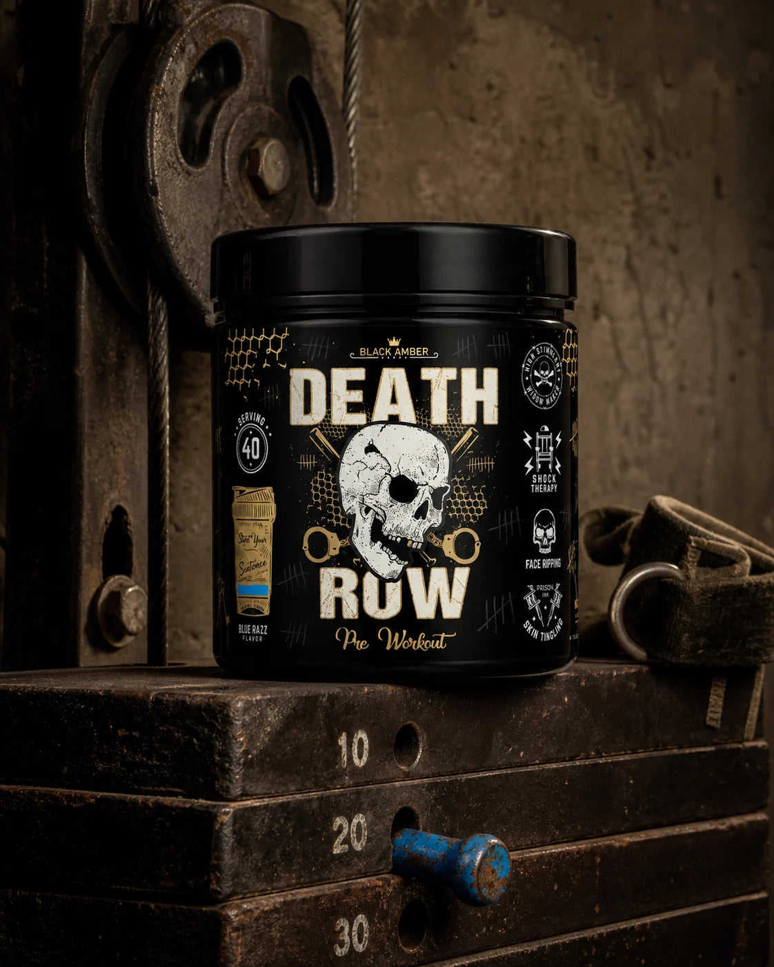 Black Amber Death Row Blue Razz pre-workout tub on an iron pulley-machine weight stack