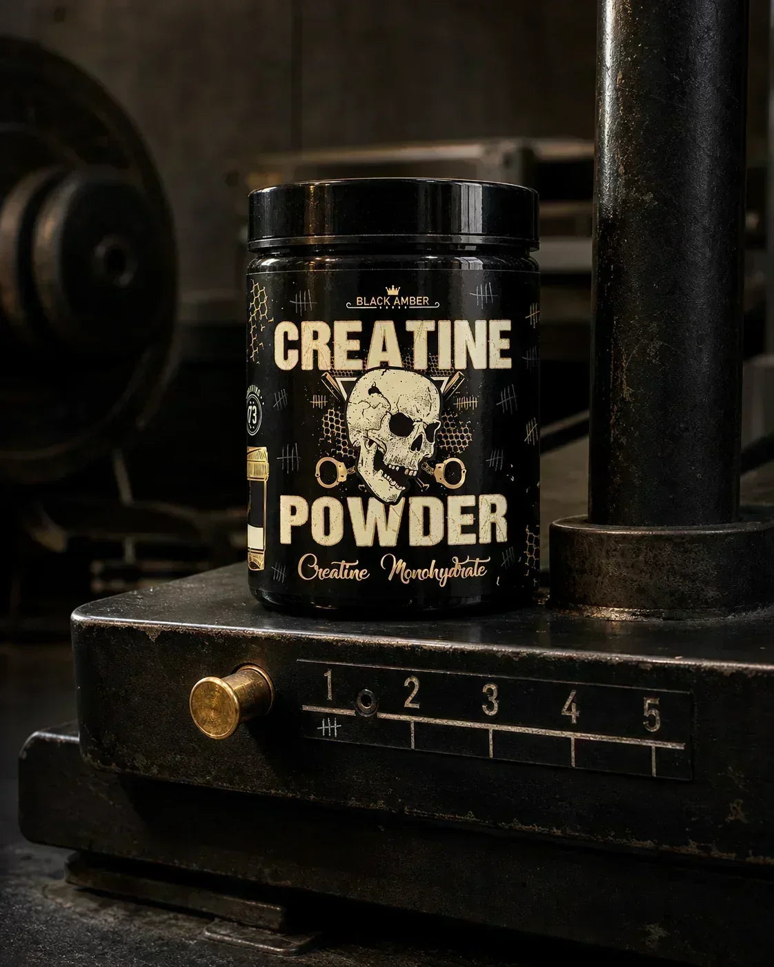 Whole Black Amber Creatine Powder tub on a worn belt-squat machine platform beside a gold adjustment pin