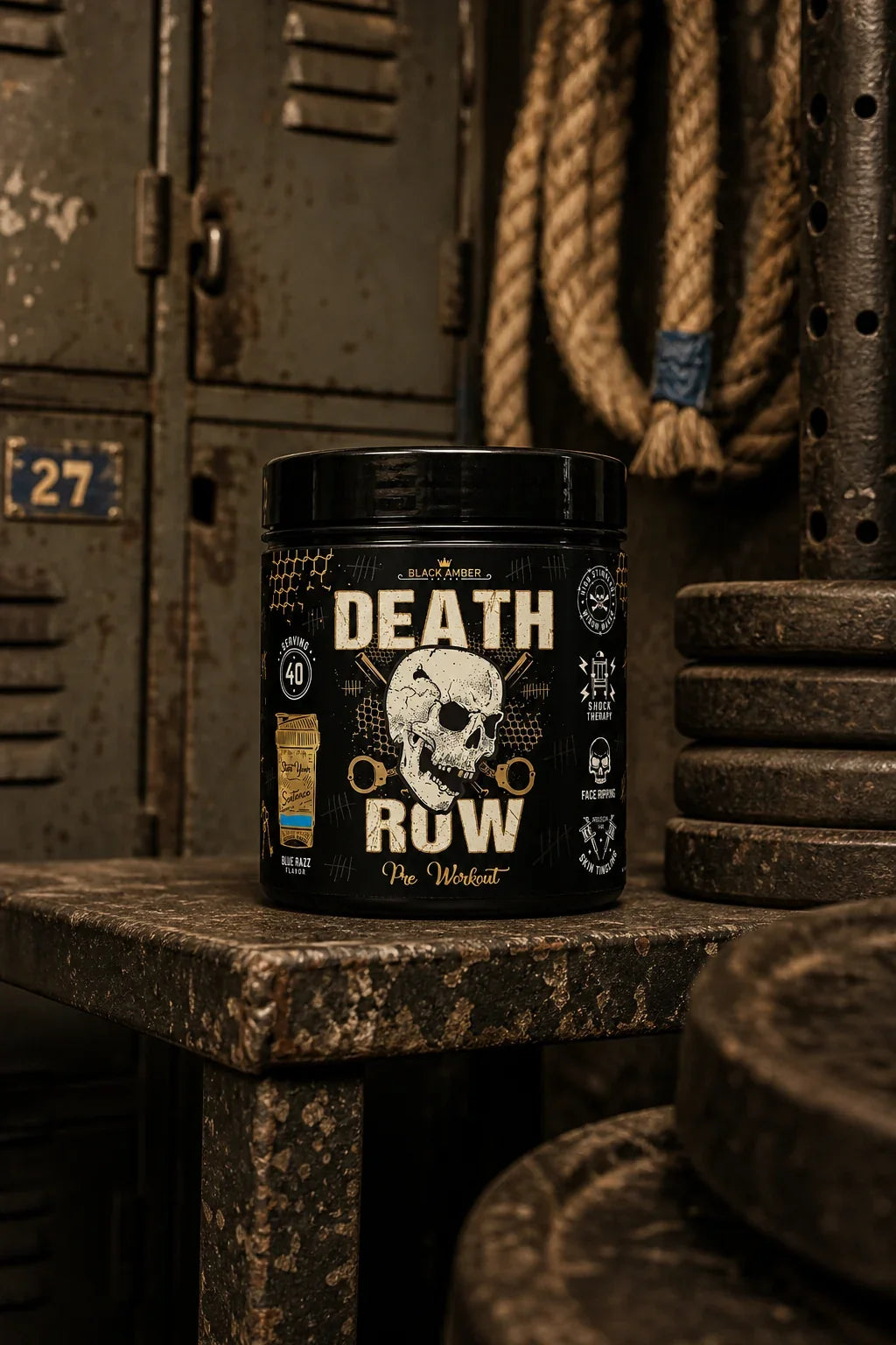 Black Amber Death Row Blue Razz tub on a concrete shelf beside ropes and iron plates