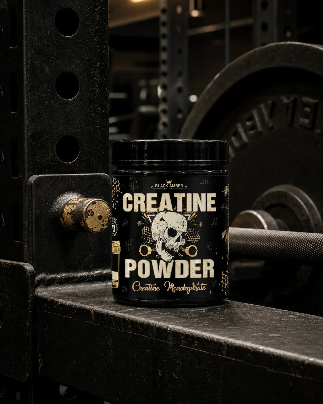 Black Amber Creatine Powder tub resting on a steel power-rack crossmember beside weight plates