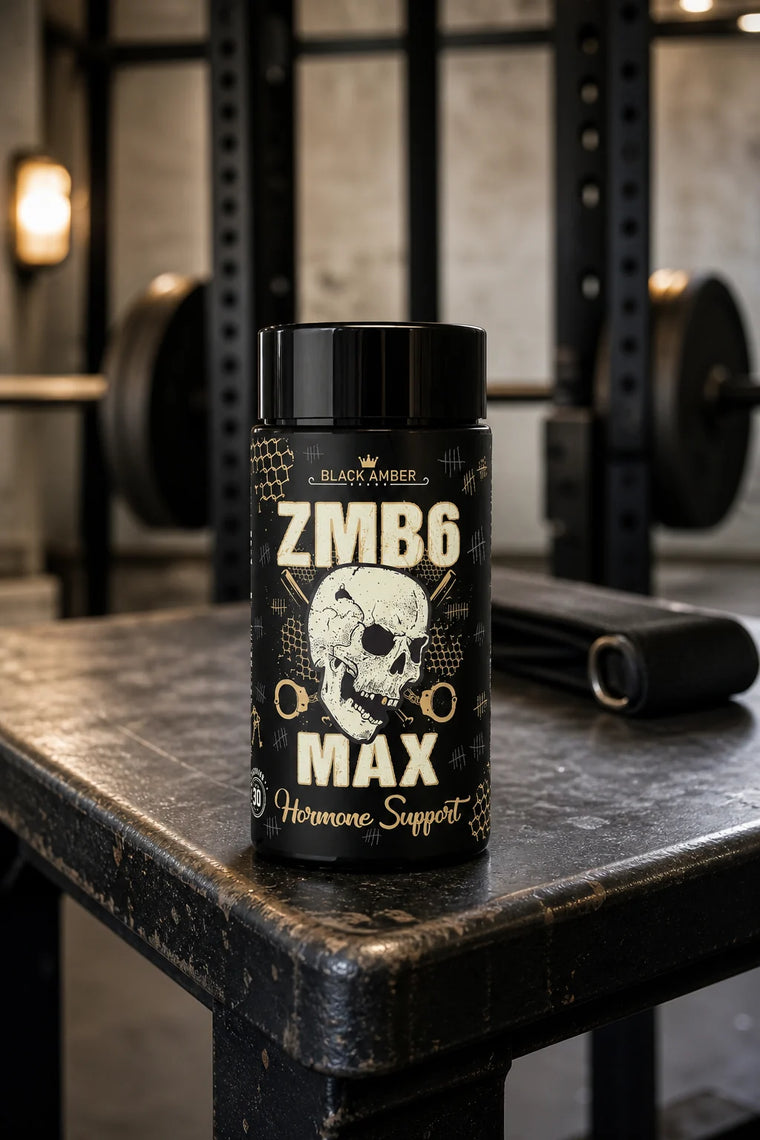 Black Amber ZMB6 Max bottle on a worn iron gym bench beside a lifting strap