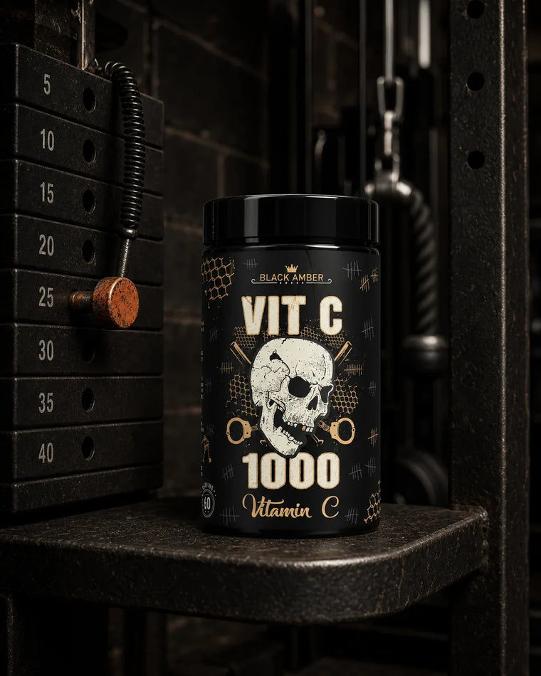 Black Amber Vitamin C 1000 bottle beside a gym cable-machine weight selector