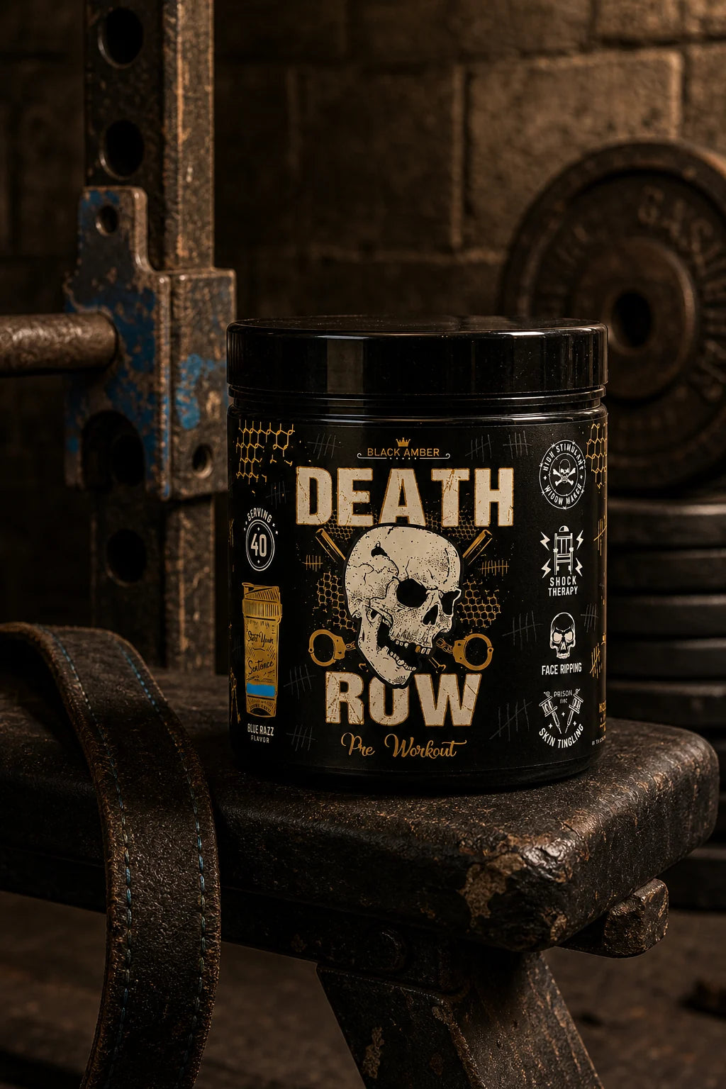 Black Amber Death Row Blue Razz pre-workout tub on a worn training bench beside an iron rack