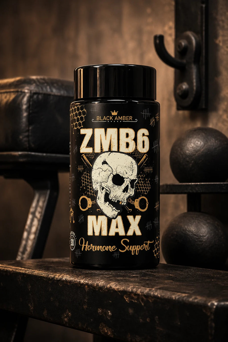 Black Amber ZMB6 Max capsule bottle on a worn gym bench beside dumbbells