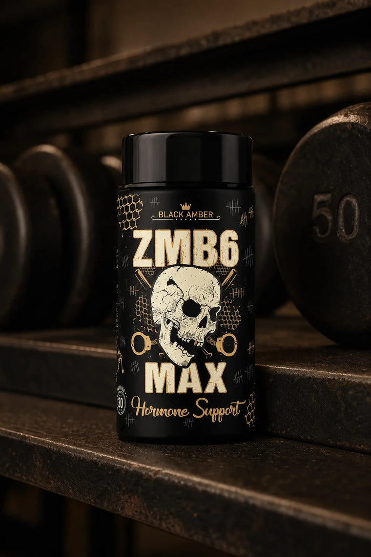 Black Amber ZMB6 Max bottle beside old iron dumbbells on a worn steel rack