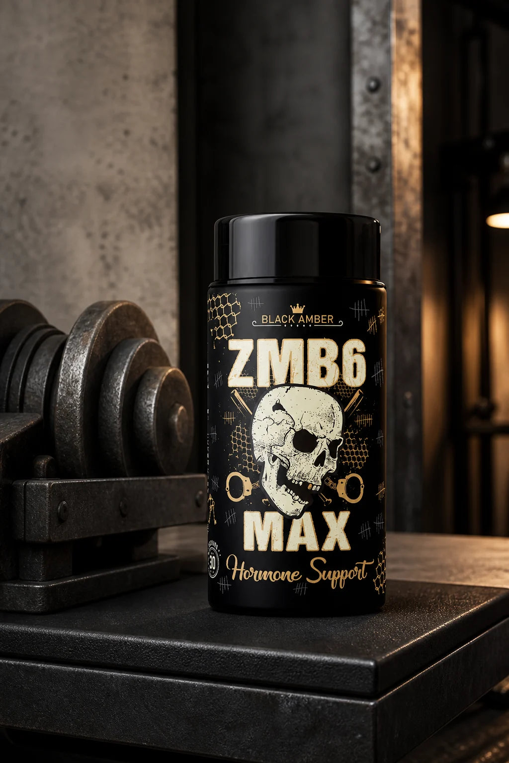 Black Amber ZMB6 Max bottle on a dark padded bench beside iron weights in a quiet training bay
