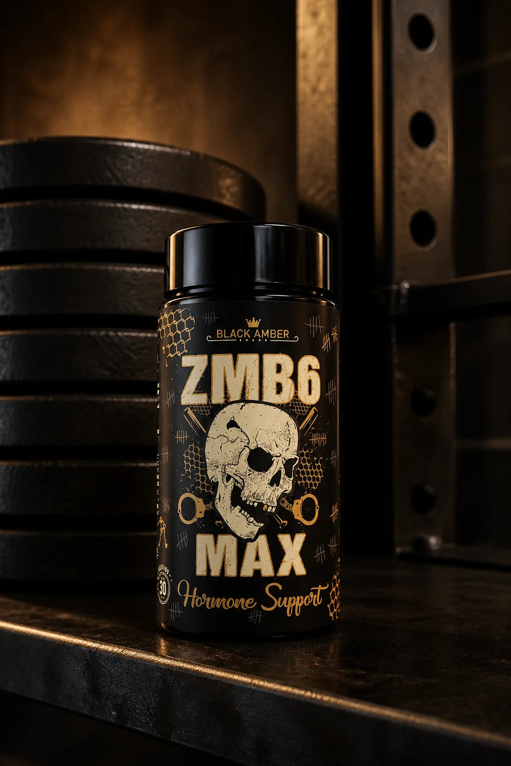 Black Amber ZMB6 Max bottle on a steel shelf beside stacked weight plates