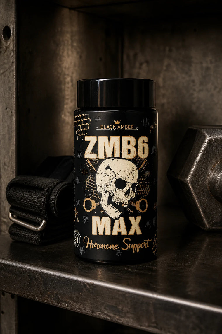 Black Amber ZMB6 Max bottle on a worn steel shelf in a concrete cubby beside a lifting strap and dumbbell