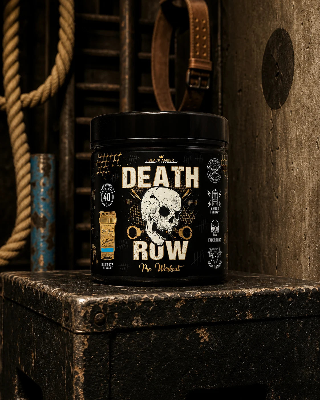 Black Amber Death Row Blue Razz pre-workout tub on a worn steel box beside a rope and wall ladder