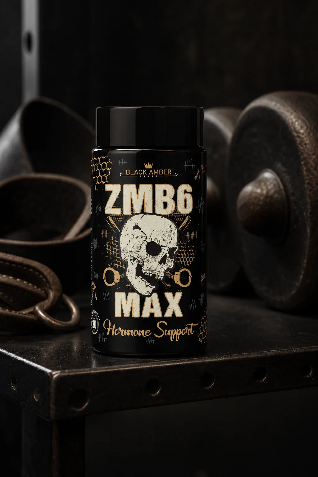 Black Amber ZMB6 Max bottle on a steel equipment shelf beside a leather training belt and iron weight
