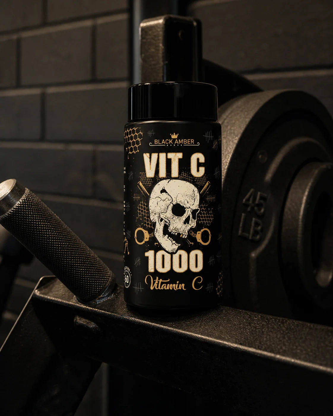 Black Amber Vitamin C 1000 bottle on an incline-press steel platform beside a knurled handle