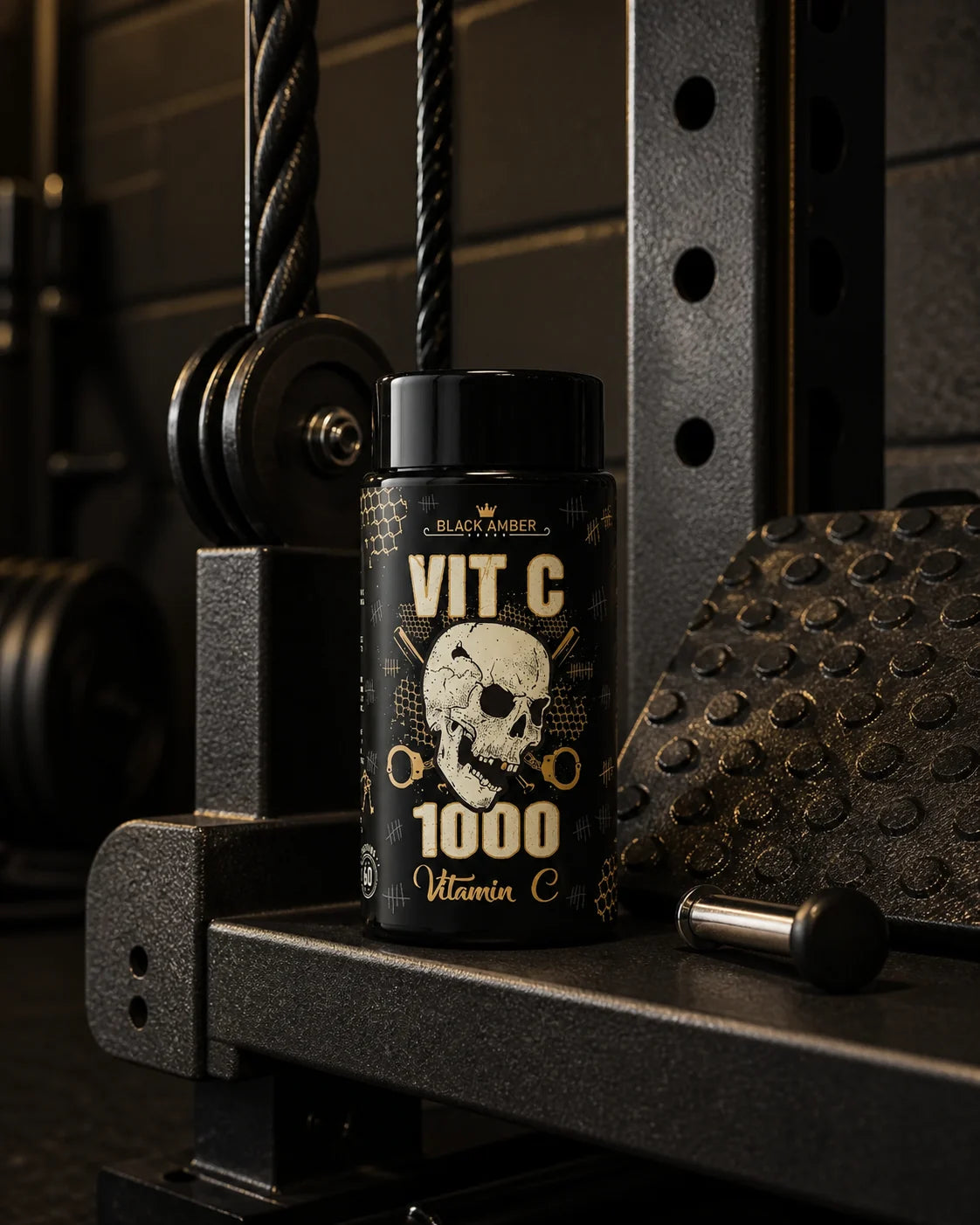 Black Amber Vitamin C 1000 bottle on a cable-machine shelf beside a pulley and selector pin