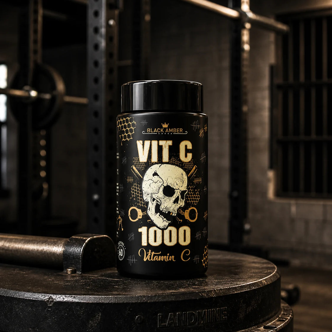 Black Amber Vitamin C 1000 capsule bottle on a steel landmine-pivot base in a gym