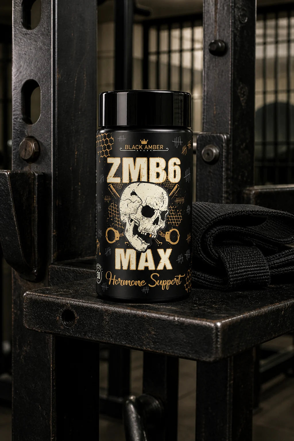 Black Amber ZMB6 Max bottle on a steel pull-up frame shelf beside folded training straps