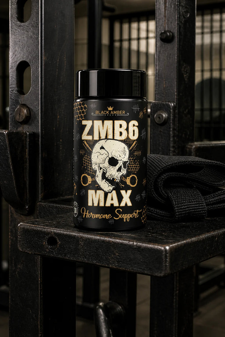 Black Amber ZMB6 Max bottle on a steel pull-up frame shelf beside folded training straps