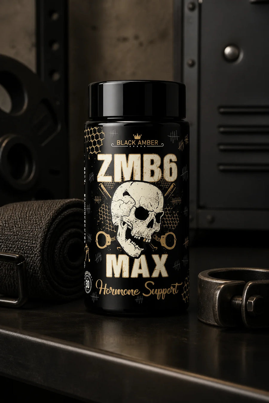 Black Amber ZMB6 Max bottle beside a folded towel and weight collar at a gym recovery station